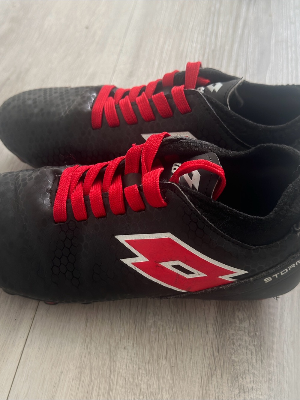OTTO Black Athletic Soccer Cleats with Red Accents